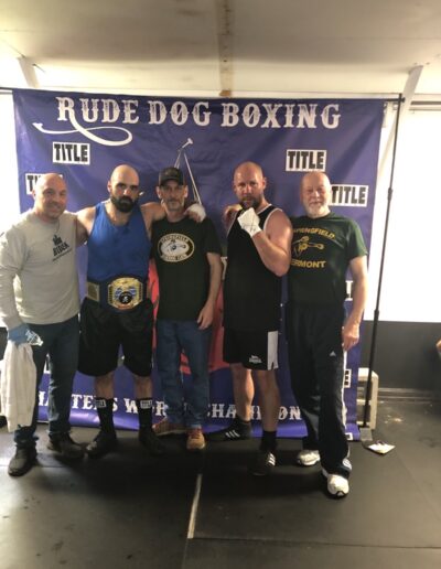 Both boxers with their coaches.
